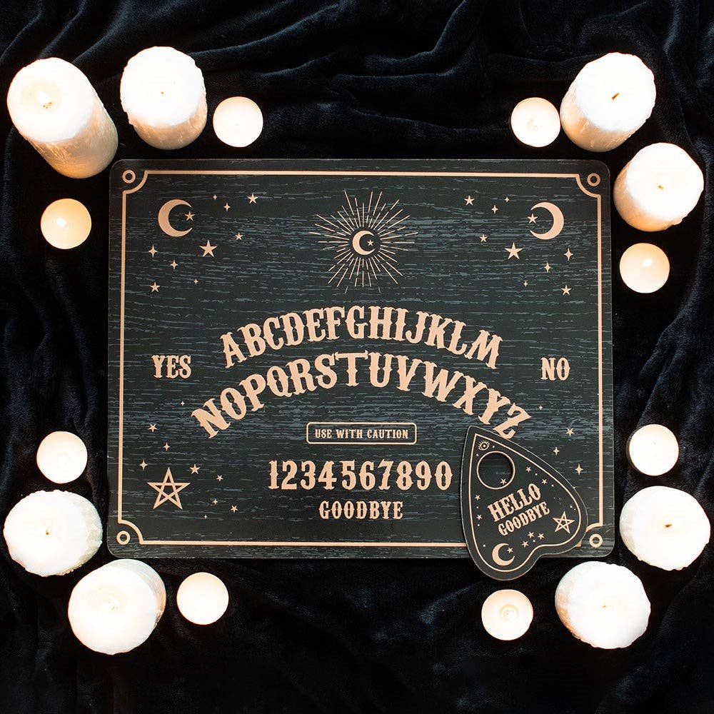 Schwarzes Ouija-Brett mit Planchette