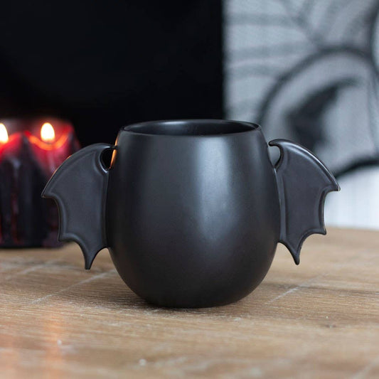 Tasse mit Fledermausflügeln