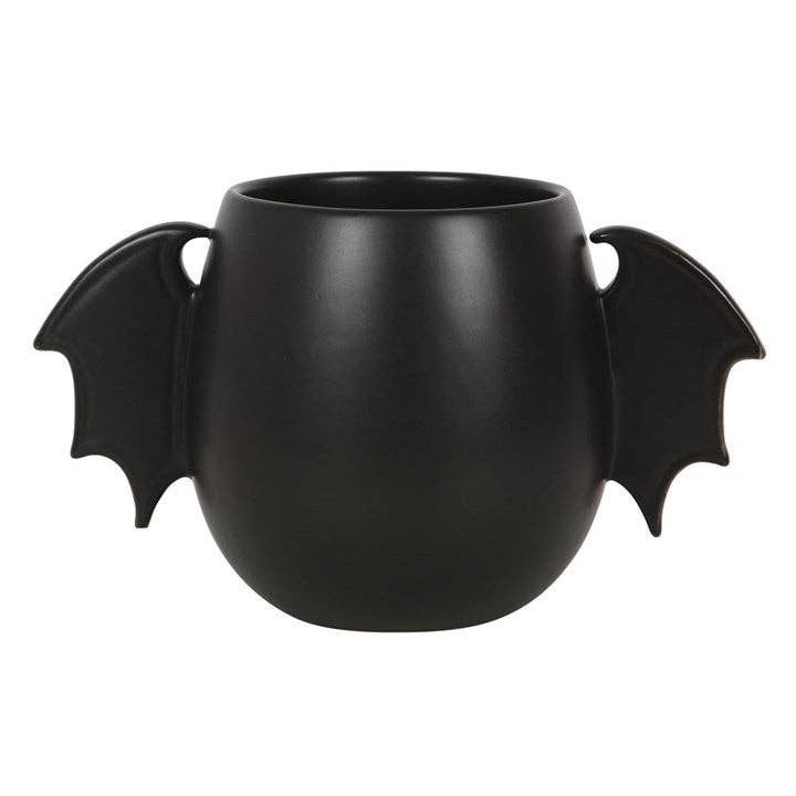 Tasse mit Fledermausflügeln